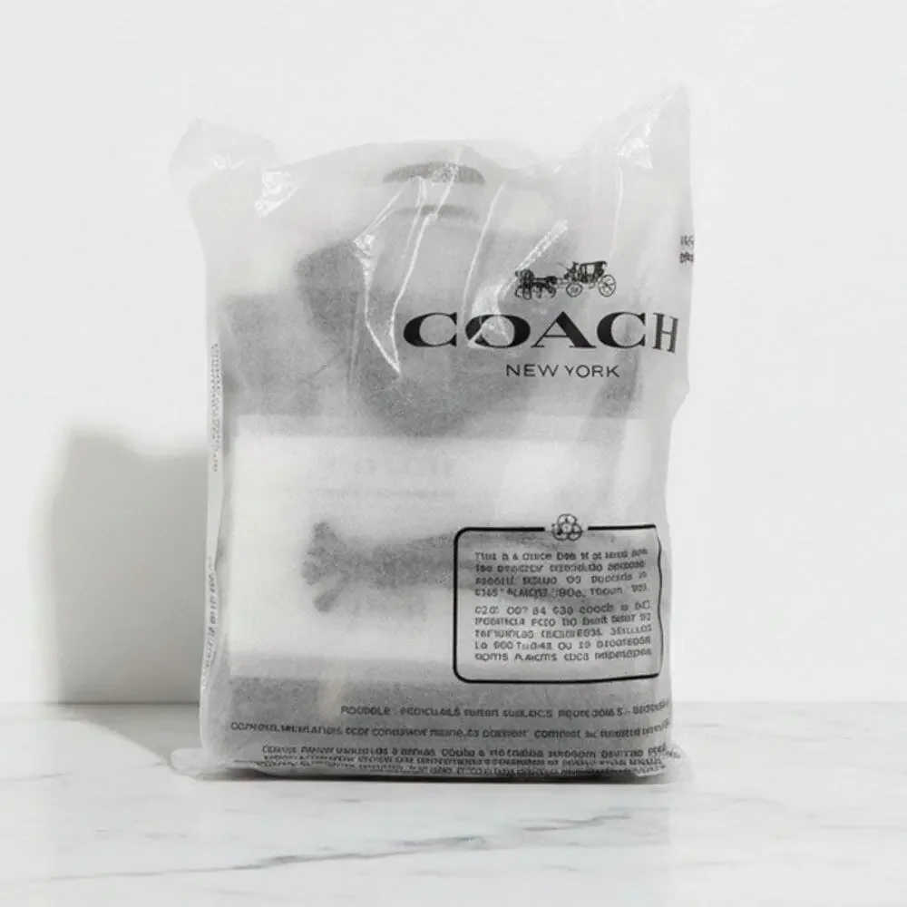 Coach flask penguin